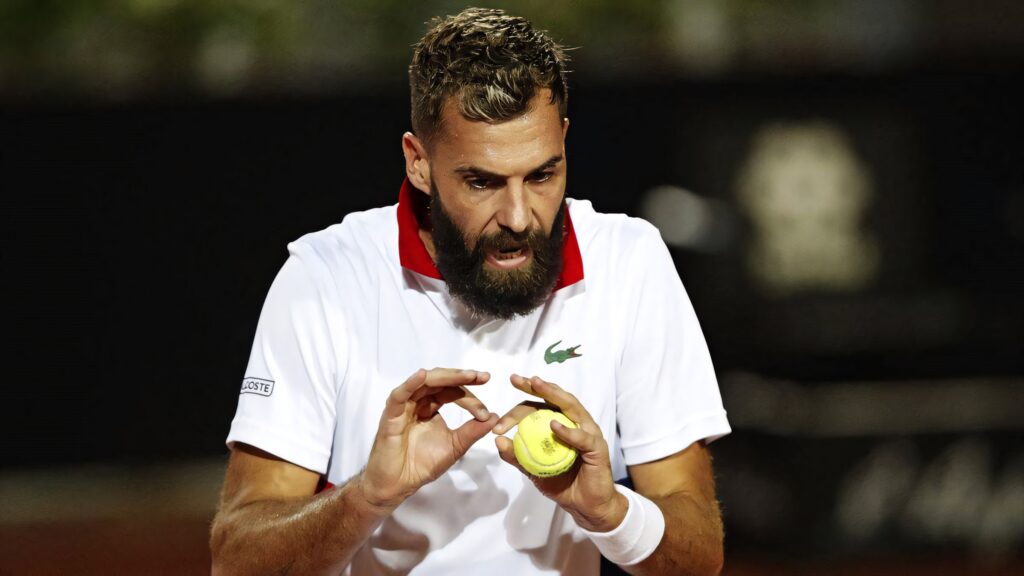 Benoît Paire focused preparing to serve in competitive tennis match intense concentration wallpaper