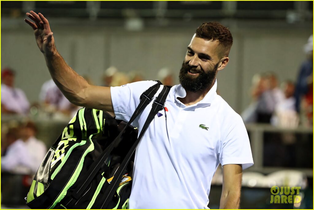 Tennis star Benoît Paire smiling waving carrying gear on court dynamic sports action wallpaper
