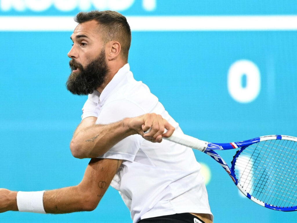 Benoît Paire mid-swing tennis action intense focus athletic skill on court wallpaper background