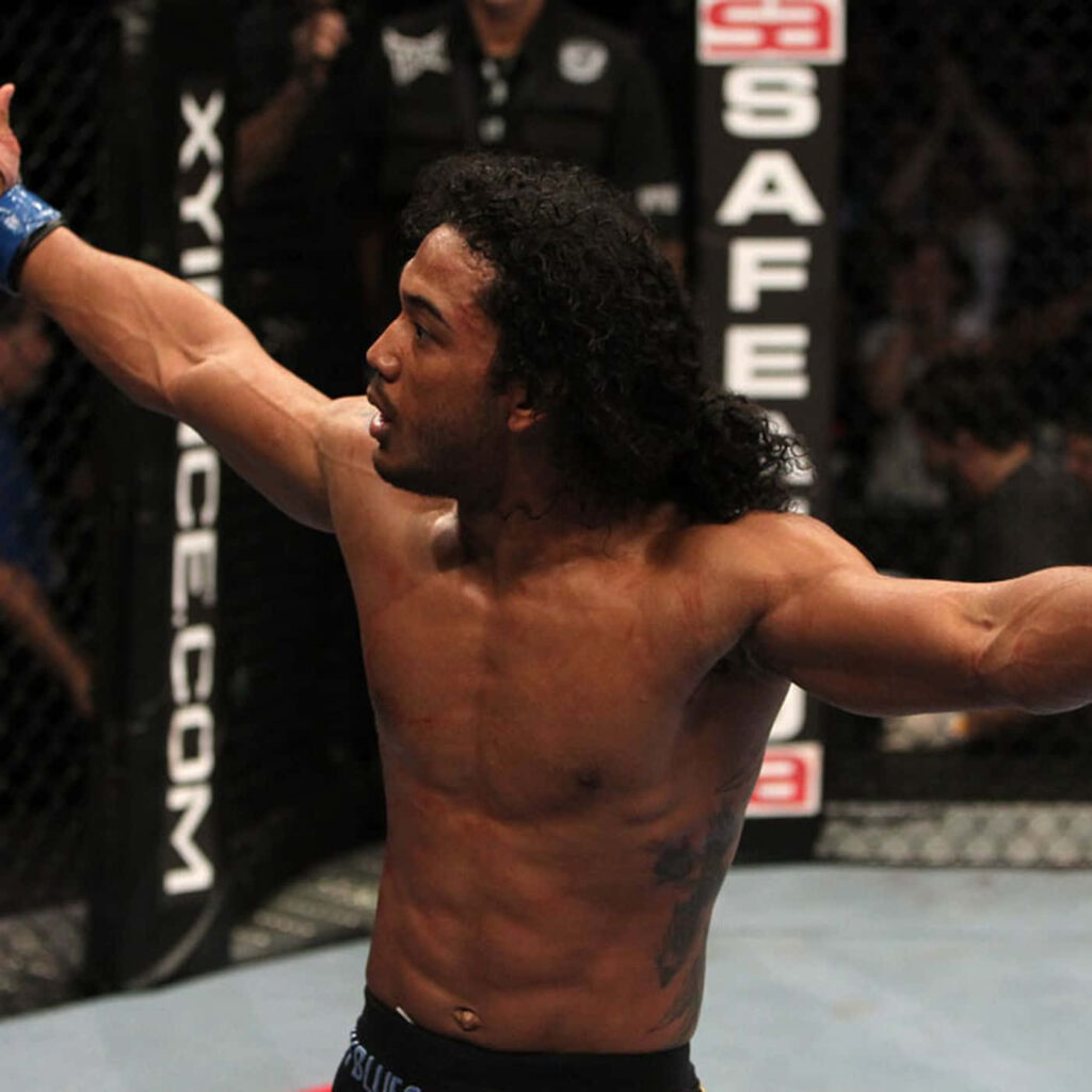 Benson Henderson celebrating victory inside octagon showing athletic build MMA wallpaper