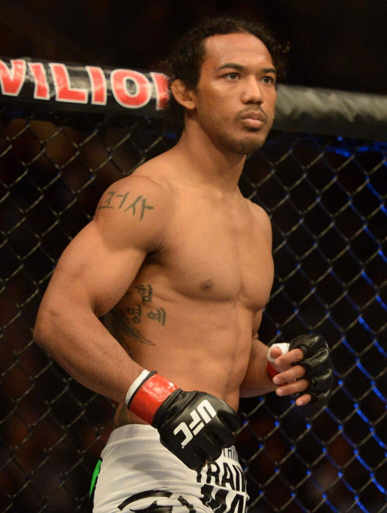 Benson Henderson focused inside octagon showcasing athletic physique and MMA fight intensity wallpaper
