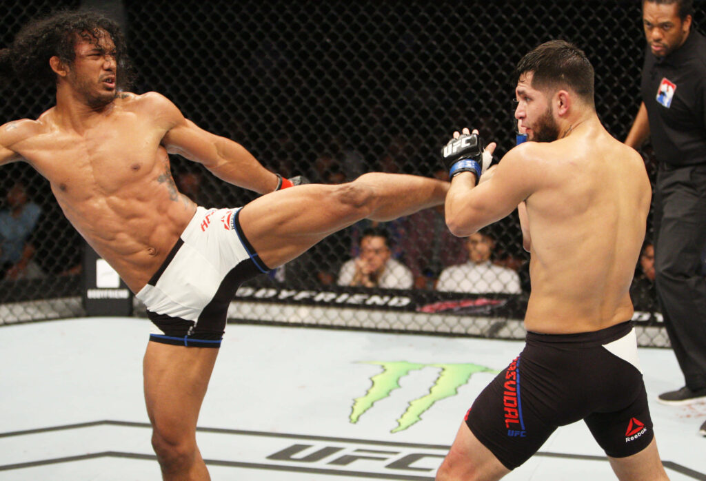 Benson Henderson lands powerful kick on Jorge Masvidal UFC fight intense octagon moment wallpaper