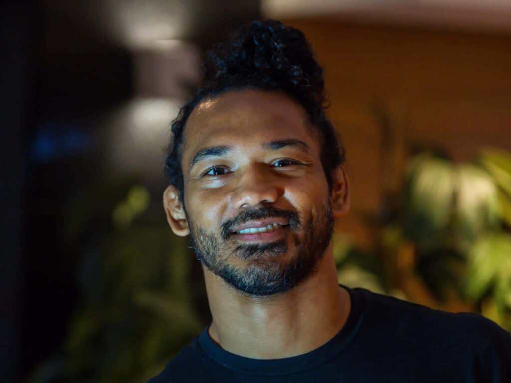 Benson Henderson smiling in bokeh wallpaper background showcasing relaxed American MMA fighter