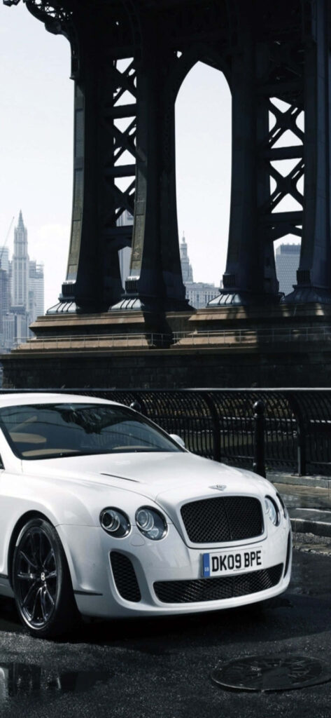Luxury Wheels: Captivating Bentley Showcased Against a Clean Background Wallpaper