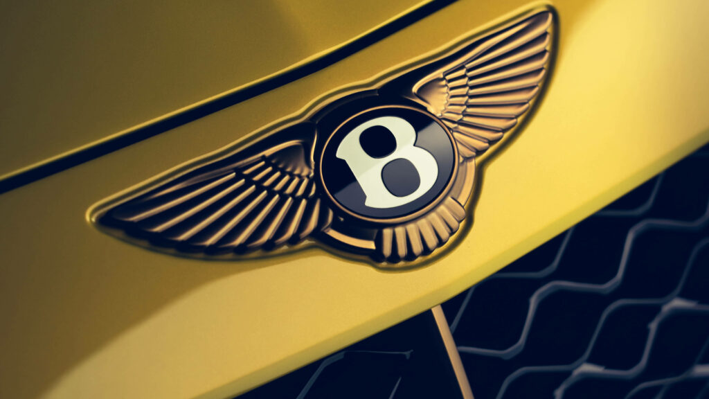 Bentley's Exquisite Mulliner Bacalar: A Captivating Close-Up of the Majestic Winged B Logo Wallpaper