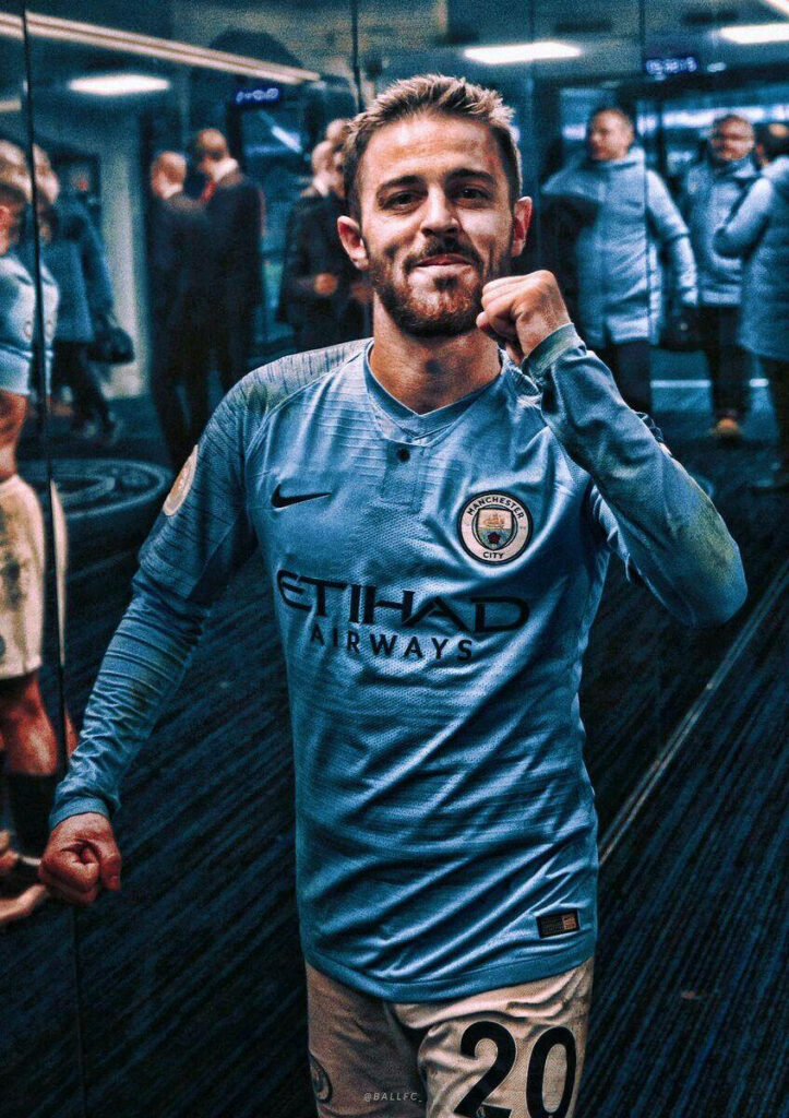 Bernardo Silva celebrating in Manchester City jersey locker room triumphant football star wallpaper