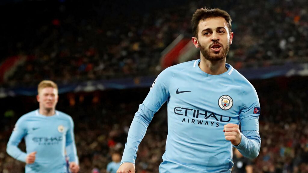 Bernardo Silva sprinting in Manchester City kit focused during a live football match wallpaper