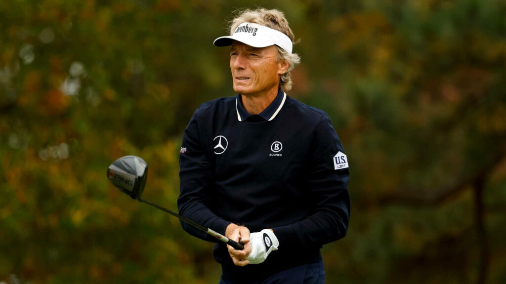 Bernhard Langer focused on golf course holding club natural outdoor background wallpaper