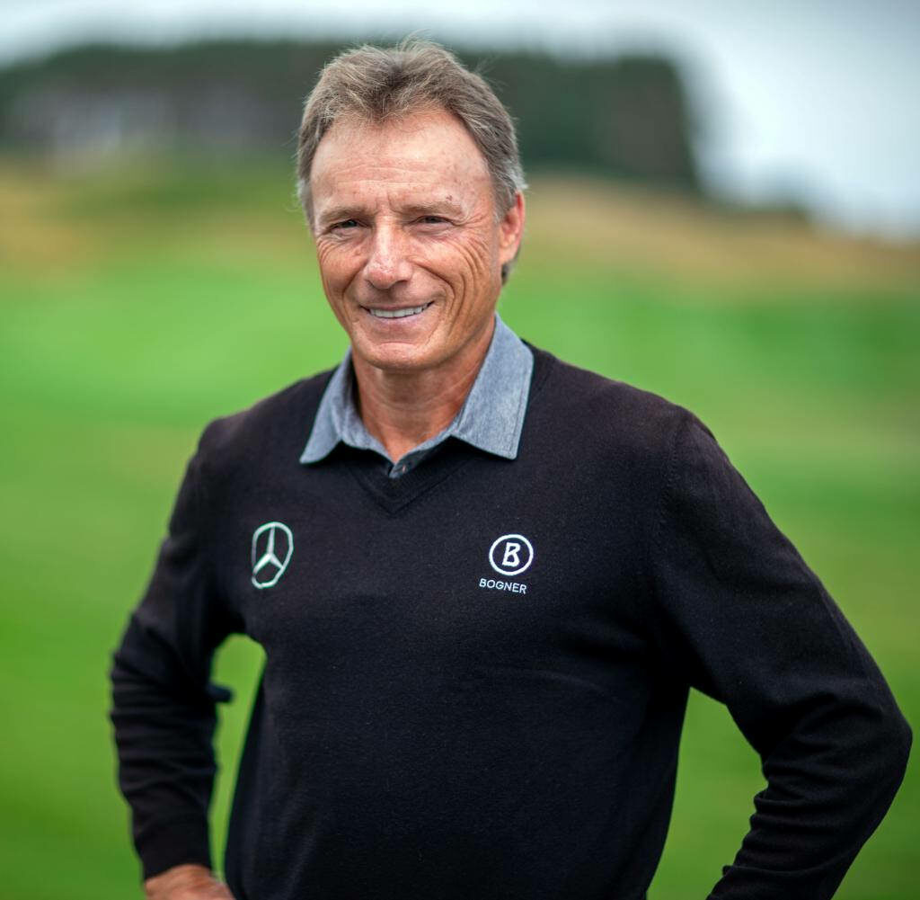 Bernhard Langer confident portrait on lush green golf course wearing professional golf attire wallpaper