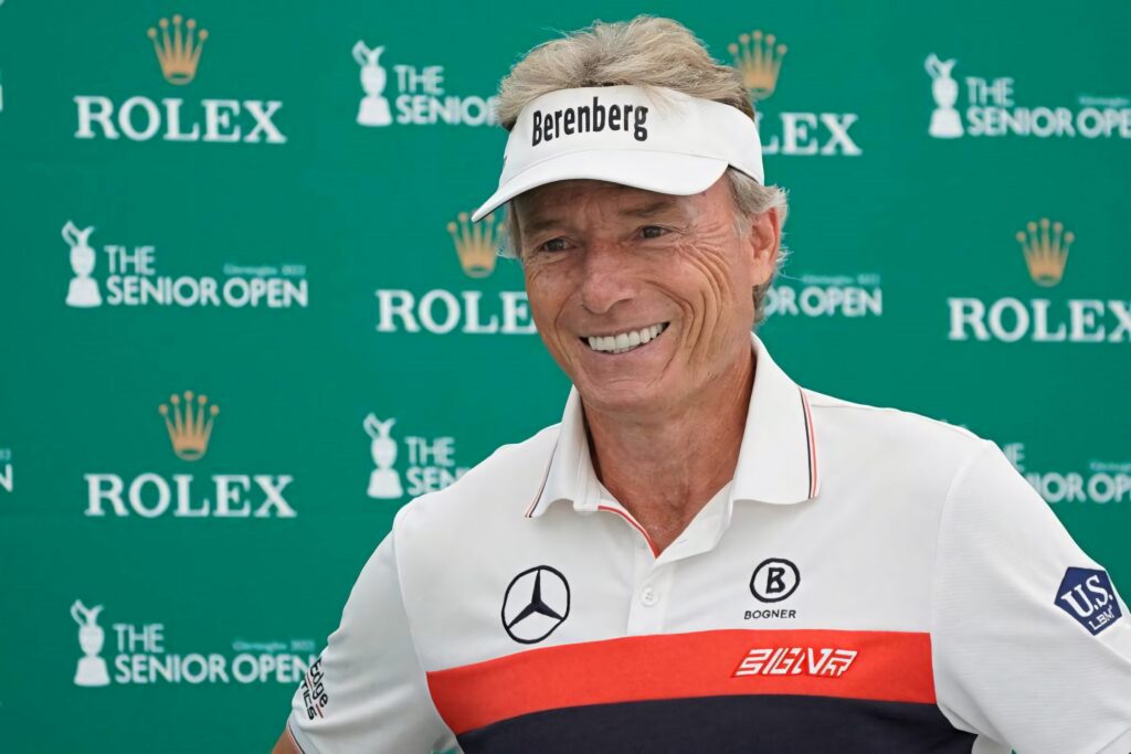 Bernhard Langer smiling at Senior Open golf event with Rolex logo professional achievement wallpaper
