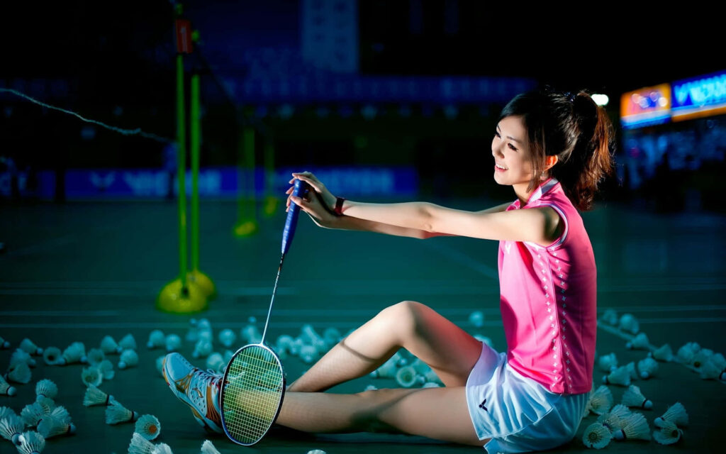 Asian Girl with Badminton Sitting Background Wallpaper
