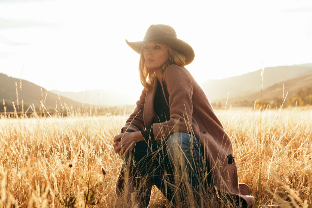 Bethany Dutton Yellowstone Wallpaper: Serene Golden Fields Background