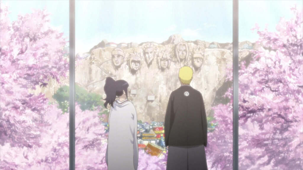 An Idyllic Scene of Naruto and Hinata Amidst Cherry Blossom Trees, Captivated by the Majestic Hokage Rock Wallpaper
