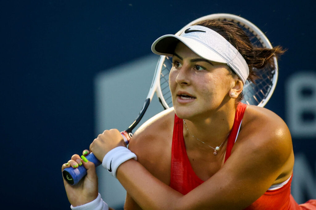 Bianca Andreescu focused tennis player showing determination and athleticism on court wallpaper