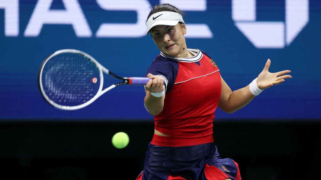 Bianca Andreescu hitting tennis ball with intense focus showing athleticism and determination Wallpaper