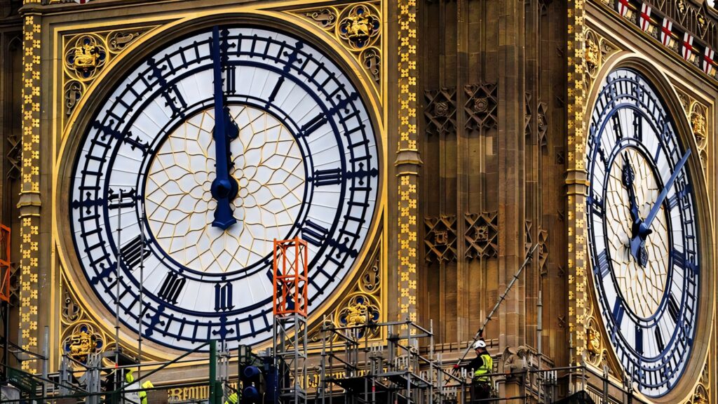 Big Ben clock tower close up showing detailed architecture and workers repairing London landmark Wallpaper