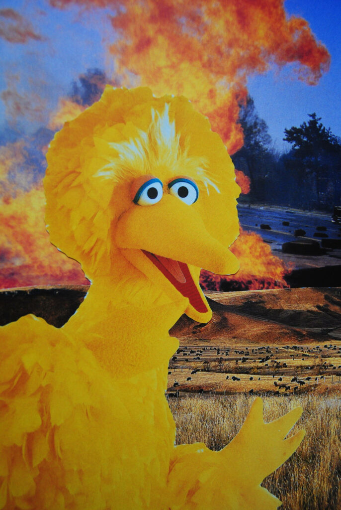 Big Bird smiling in foreground with dramatic explosion background surreal meme wallpaper scene