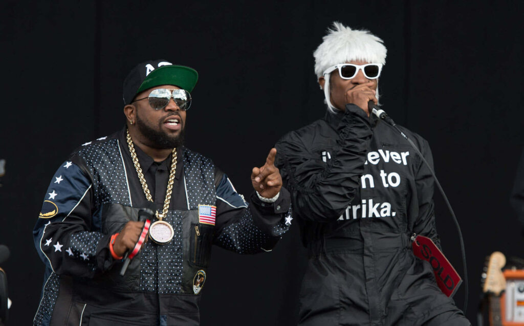 Big Boi and Andre3000 performing live on stage showcasing dynamic hip hop energy and style Wallpaper