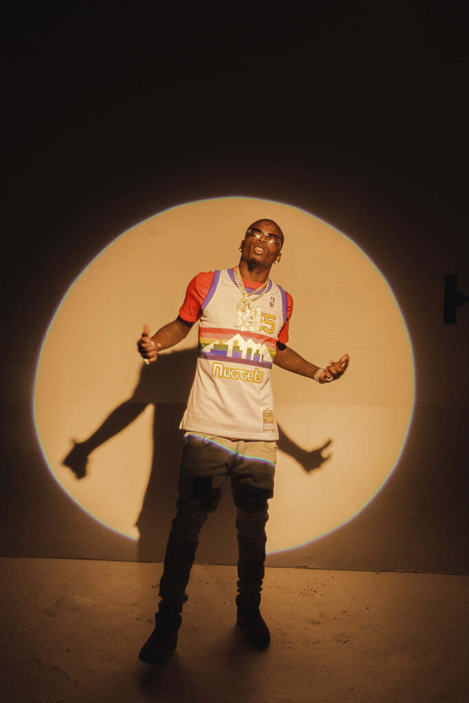 Big Boogie confident in spotlight vibrant energy stylish pose perfect Boogie wallpaper background