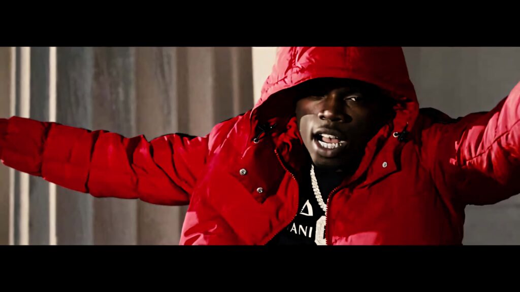 Big Boogie in vibrant red jacket with outstretched arms expressing music energy wallpaper