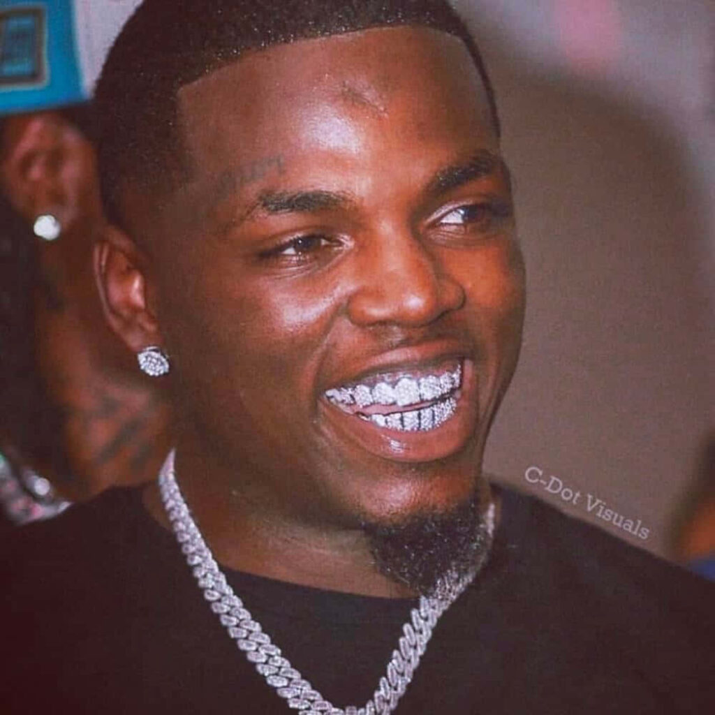 Big Boogie confident with dazzling diamond grill flashy chain vibrant wallpaper background