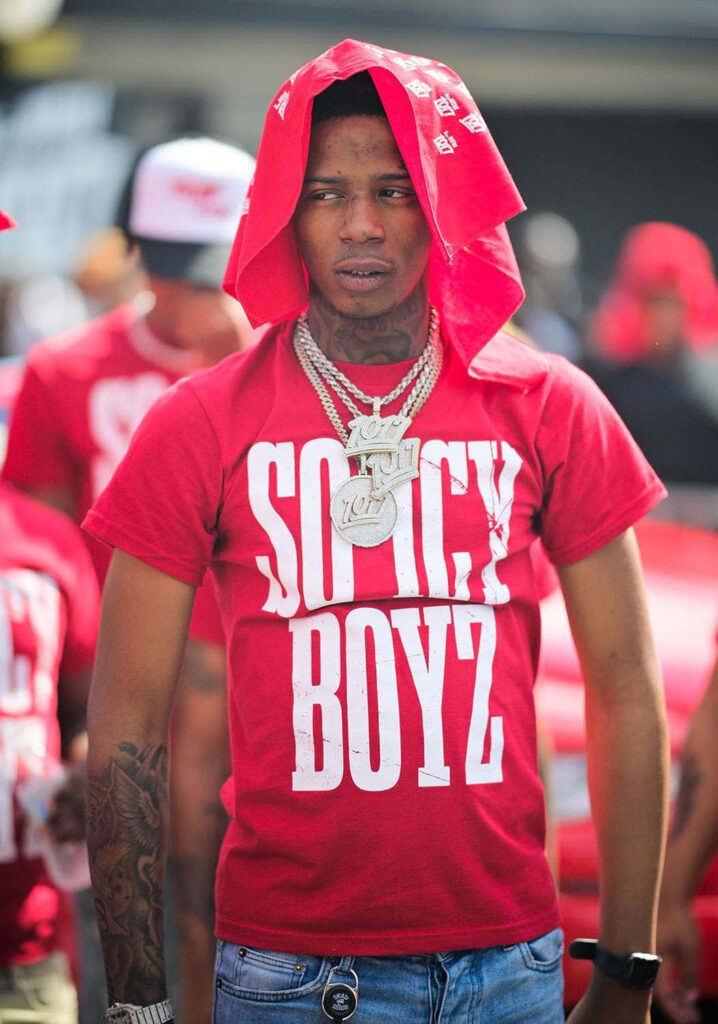 Big Scarr in red Soicy Boyz shirt and bandana vibrant wallpaper energetic American rapper style