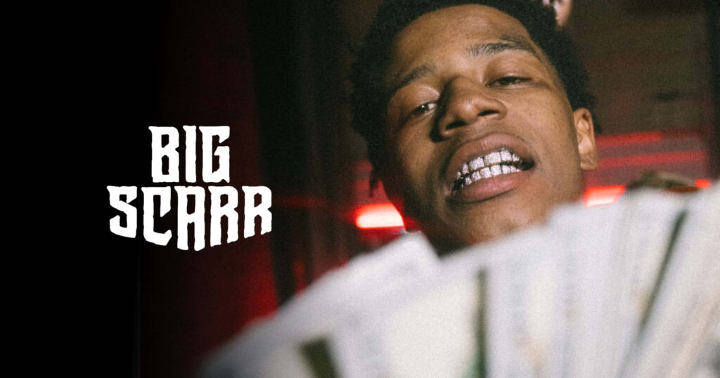 Big Scarr with diamond grills holding cash vibrant background wallpaper showcasing rapper style