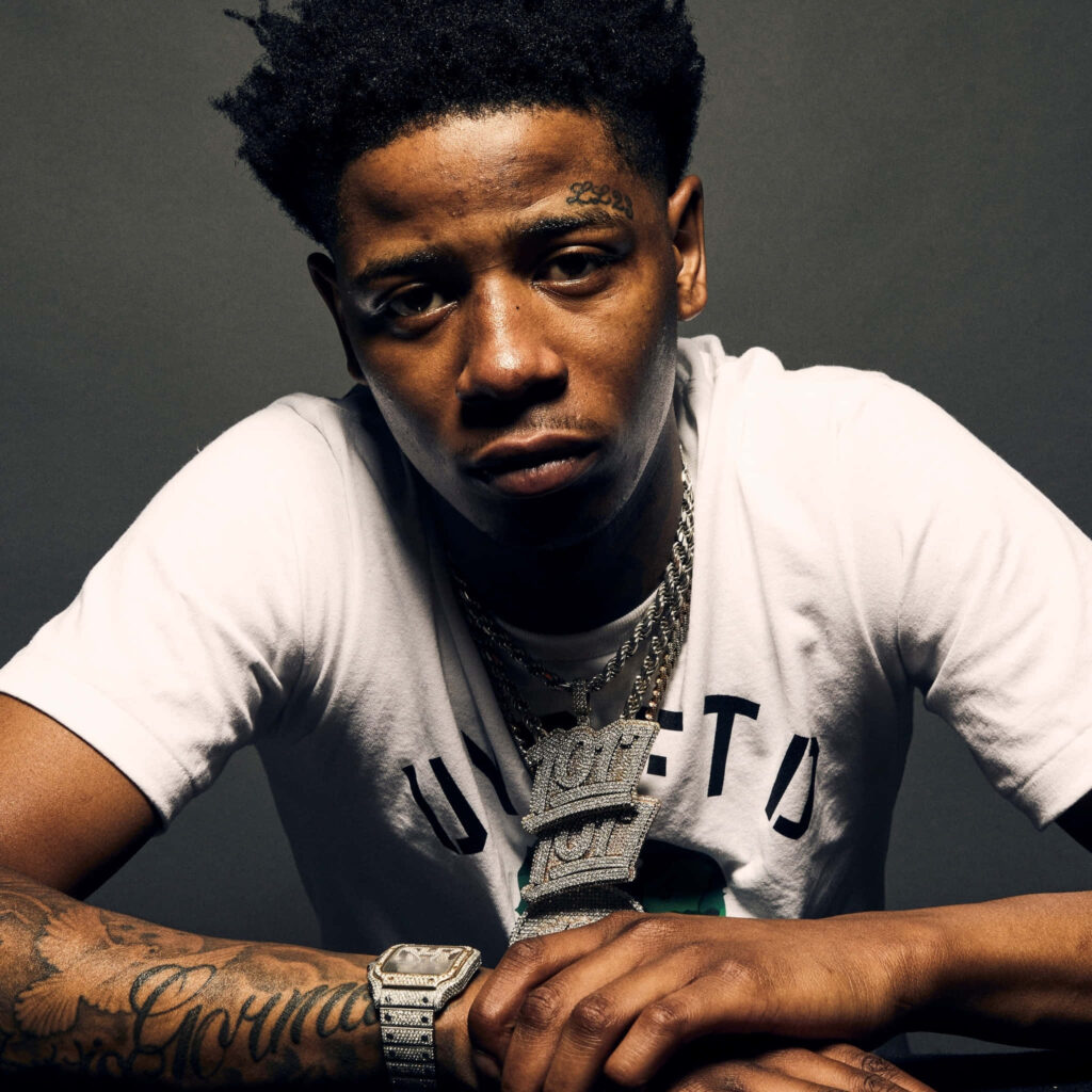 Big Scarr wallpaper American rapper in white t-shirt showing tattoos bold jewelry dark background