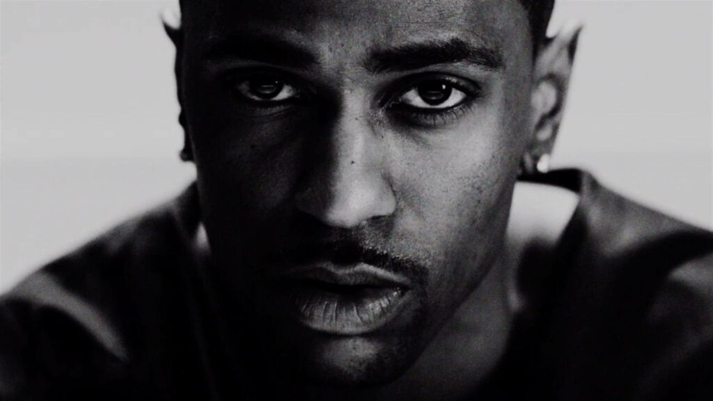 Close-up black and white portrait of rapper Big Sean with intense expression wallpaper background