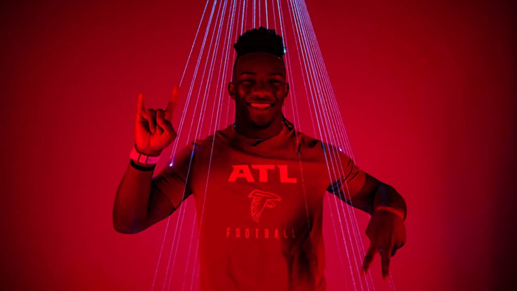 Bijan Robinson confident smile ATL Football shirt red background dynamic wallpaper lighting