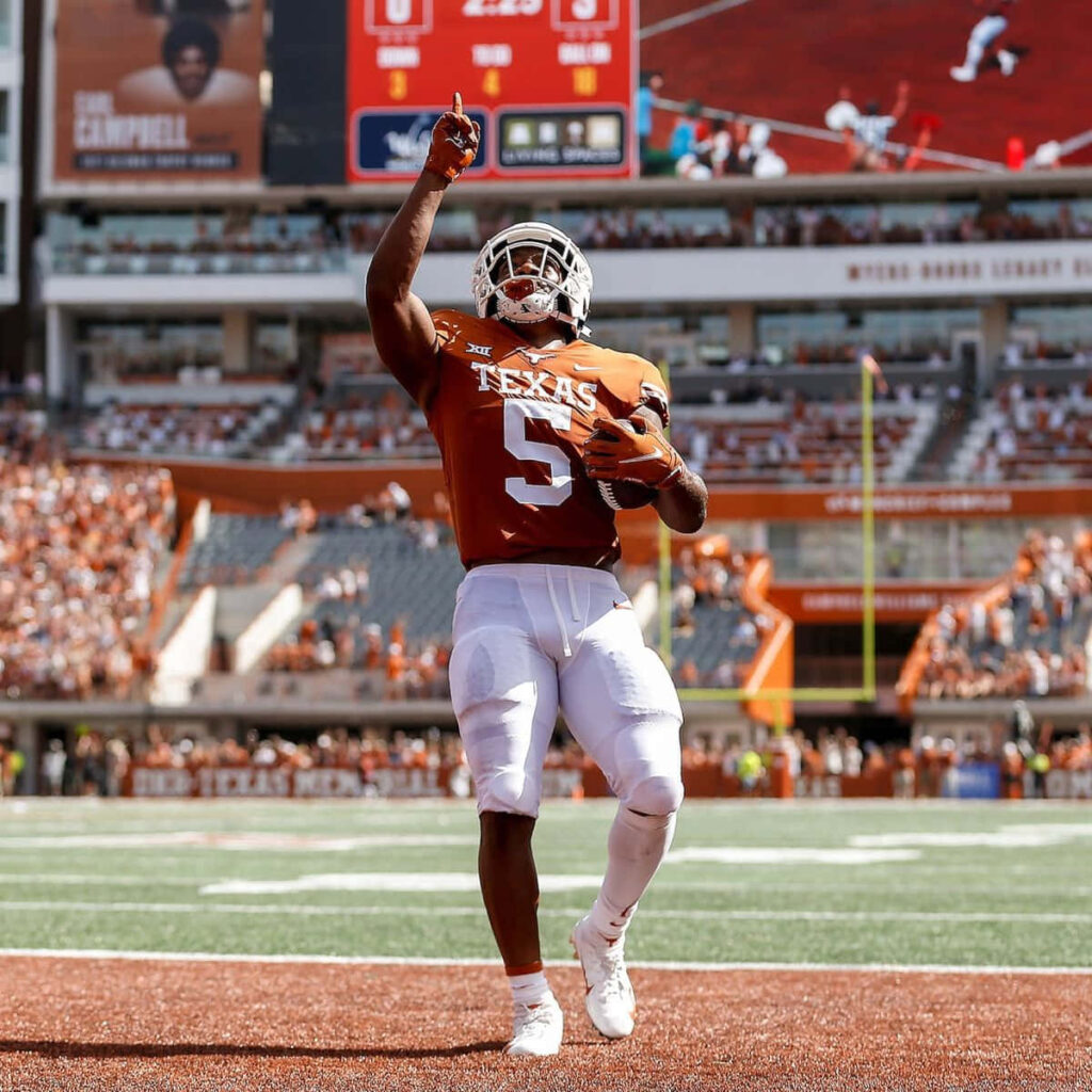 Bijan Robinson Texas Longhorns touchdown celebration football energy wallpaper background