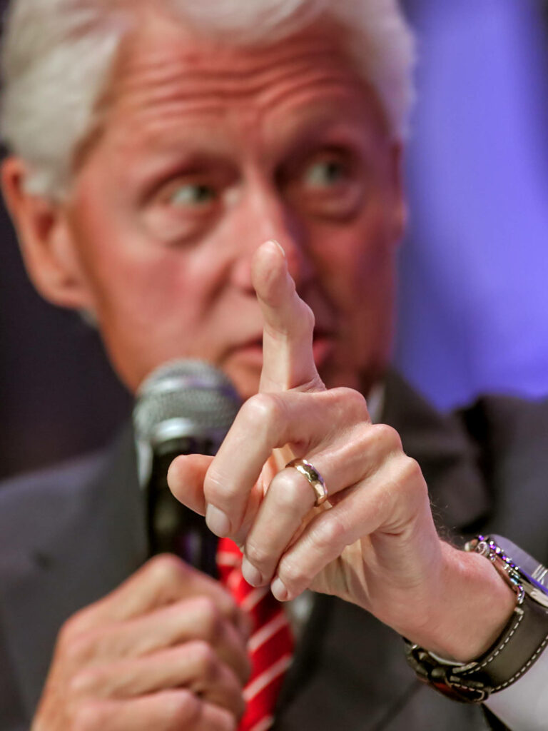 Bill Clinton speaking passionately pointing finger into microphone expressive political wallpaper