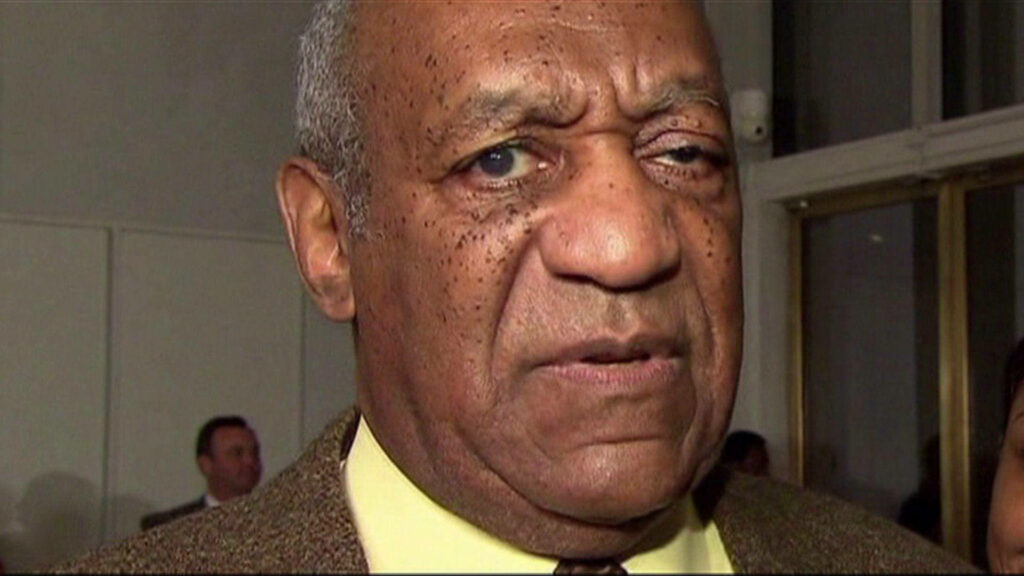 Close-up of Bill Cosby serious expression formal attire American comedian wallpaper background