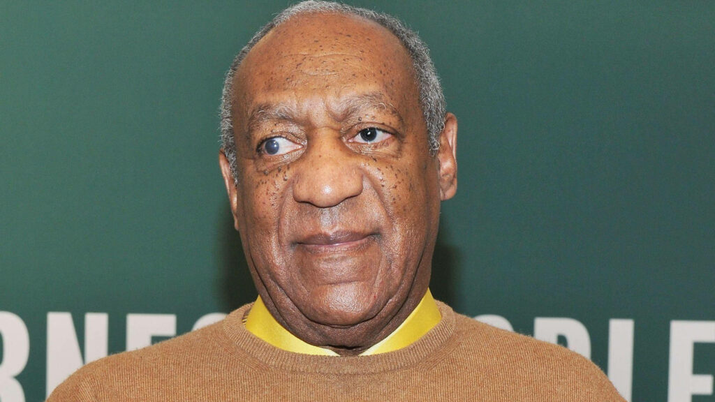 Bill Cosby portrait wallpaper brown sweater green background thoughtful expression image