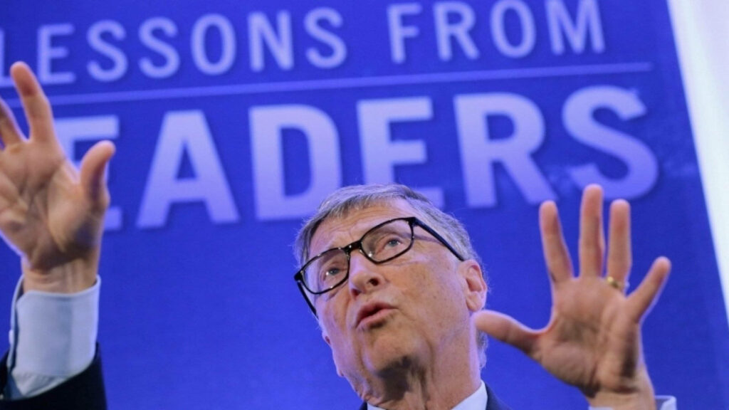 Bill Gates speaking passionately at Lessons From Leaders backdrop inspiring business leadership Wallpaper
