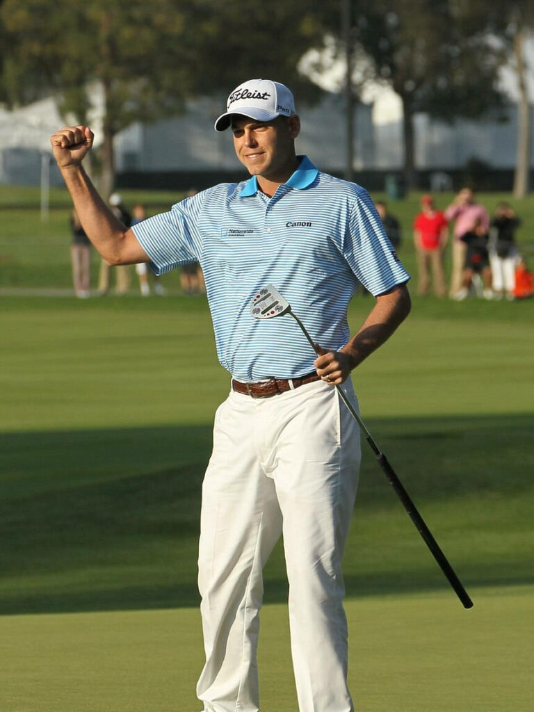 Bill Haas celebrates with clenched fist on golf course showing passion and determination wallpaper