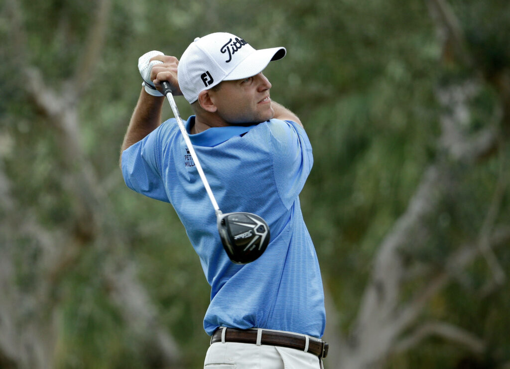 Bill Haas showcasing perfect golf swing posture and focus in a calm outdoor setting wallpaper