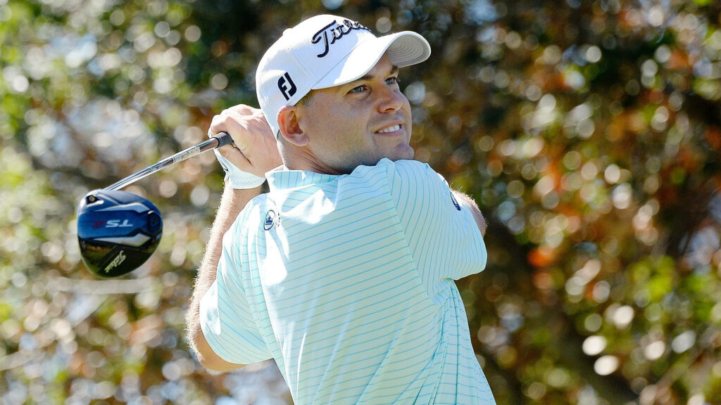 Bill Haas golf swing focused sunny day lush green golf course vibrant wallpaper background