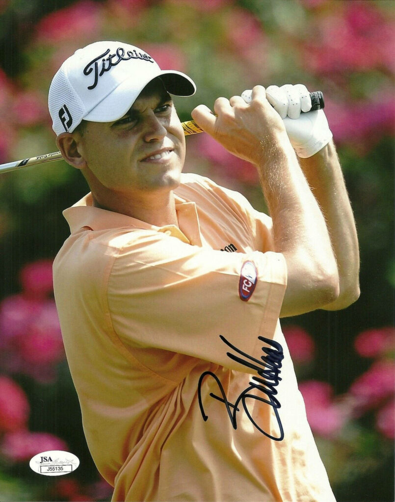 Bill Haas mid swing on golf course focused precision colorful lush background wallpaper