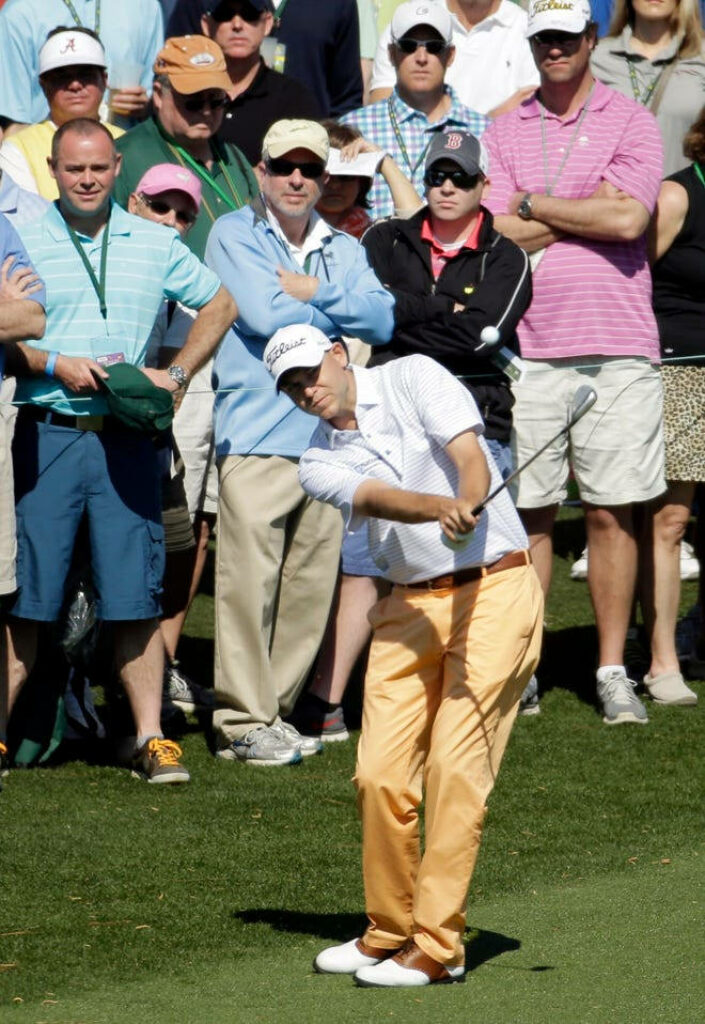 Bill Haas focused mid-swing on golf course professional golfer with crowd watching in background Wallpaper