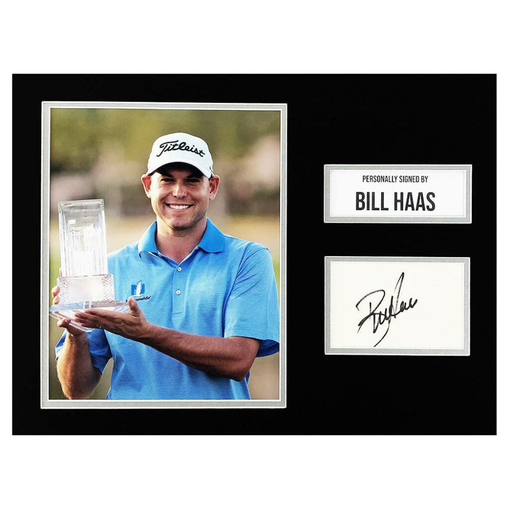 Bill Haas smiling and holding trophy with autograph in golf celebration wallpaper background