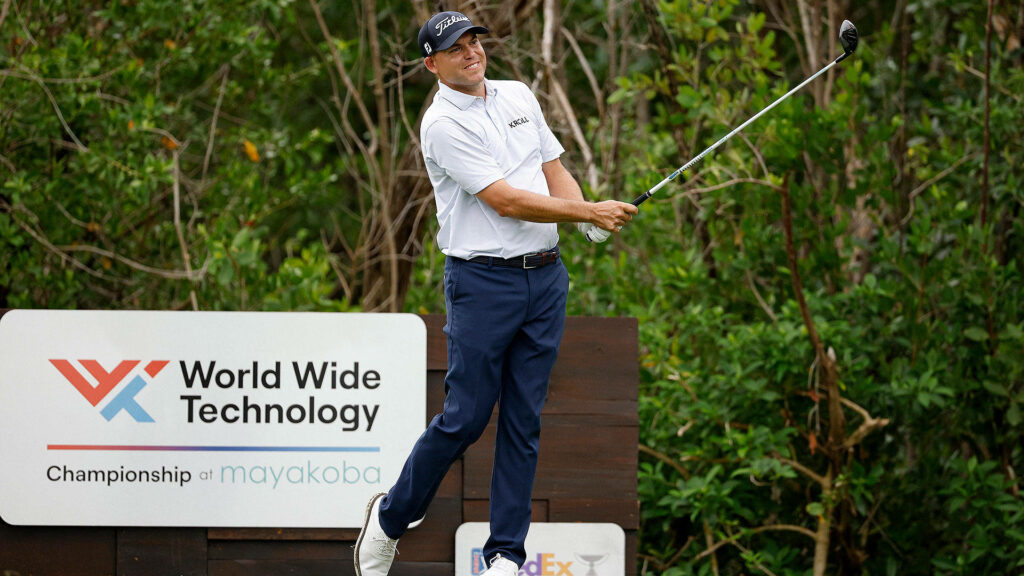 Bill Haas tees off at World Wide Technology Championship Mayakoba lush green golf course background Wallpaper