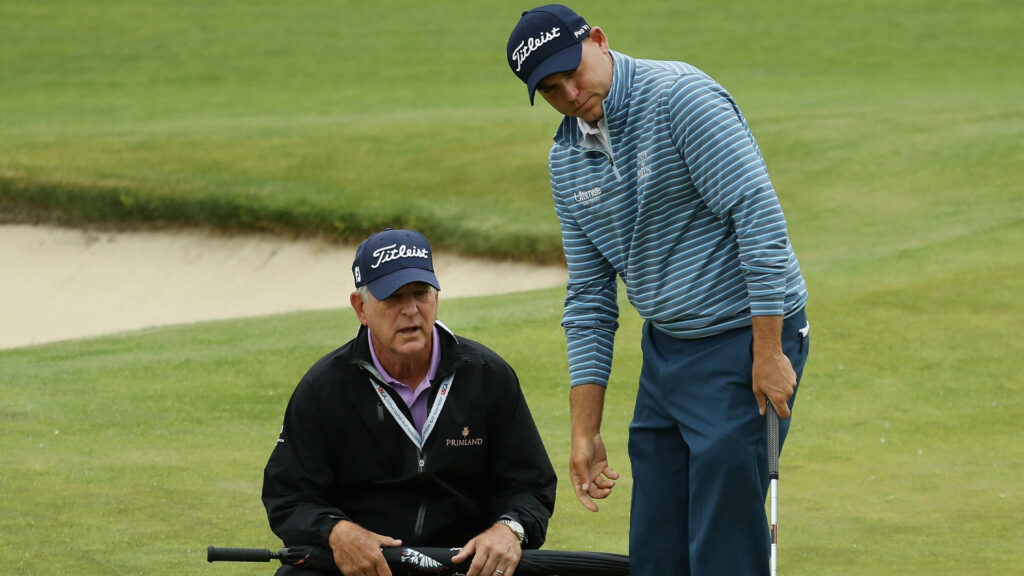Bill Haas and Jay Haas share a heartfelt moment on golf course highlighting family bond and passion Wallpaper