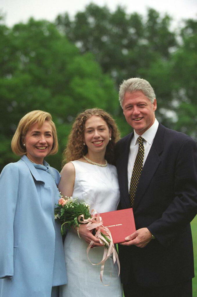 Bill Clinton Hillary Clinton and Chelsea outdoors smiling with bouquet celebrating special occasion wallpaper