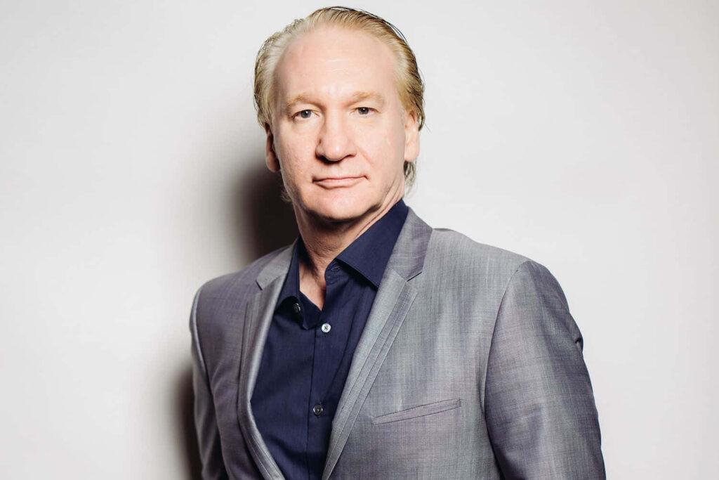 Bill Maher wallpaper featuring talk show host in sharp suit with confident thoughtful expression