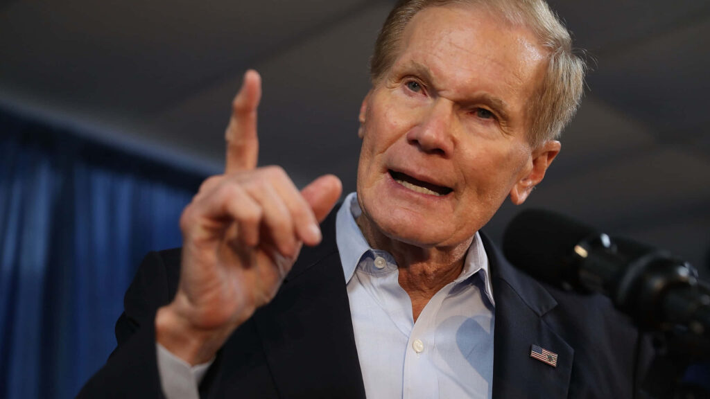 Bill Nelson speaking passionately with raised finger and intense expression at meeting wallpaper background