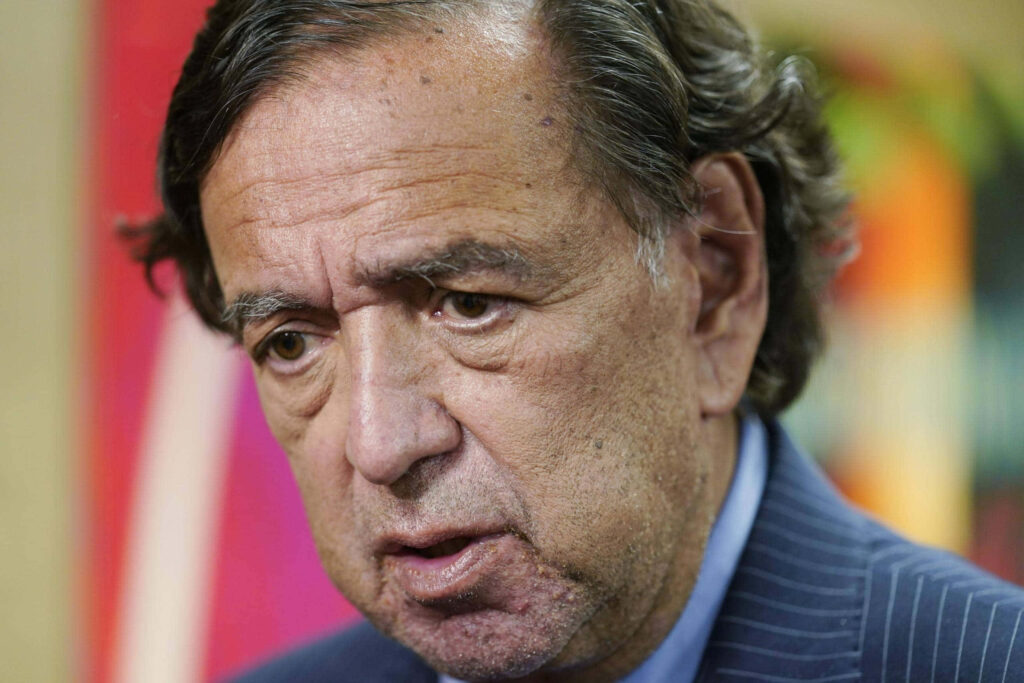 Bill Richardson close up portrait with somber expression deep in serious thoughtful mood wallpaper