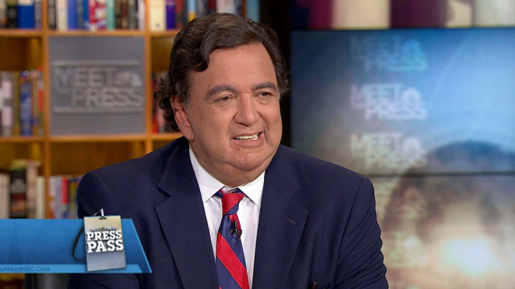 Bill Richardson interviewed on Meet the Press with bookshelves and studio background visible Wallpaper