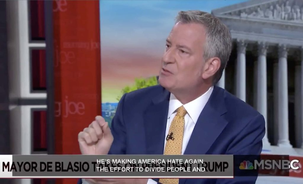 Former NYC Mayor Bill de Blasio in navy suit speaking live on MSNBC Morning Joe news broadcast studio Wallpaper