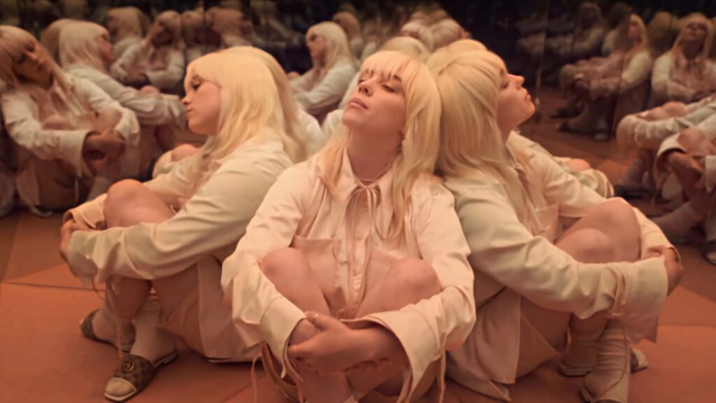 Artistic Billie Eilish Wallpaper: Mirrored Reflections in Light Outfit